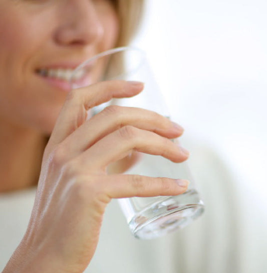 drinking a glass of water