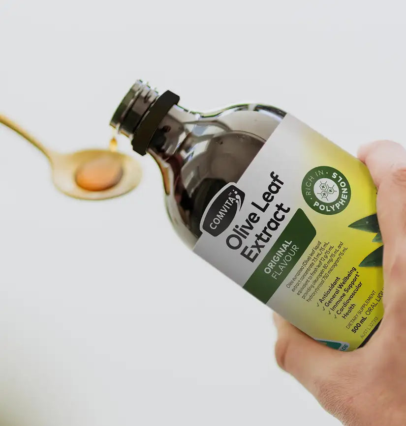 olive leaf extract pouring in to a dosing spoon