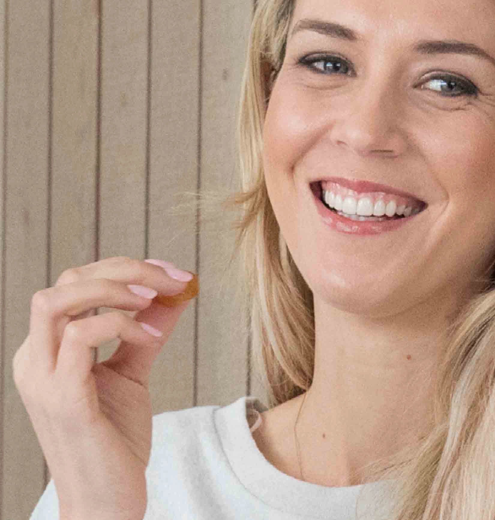 woman eating lozenge
