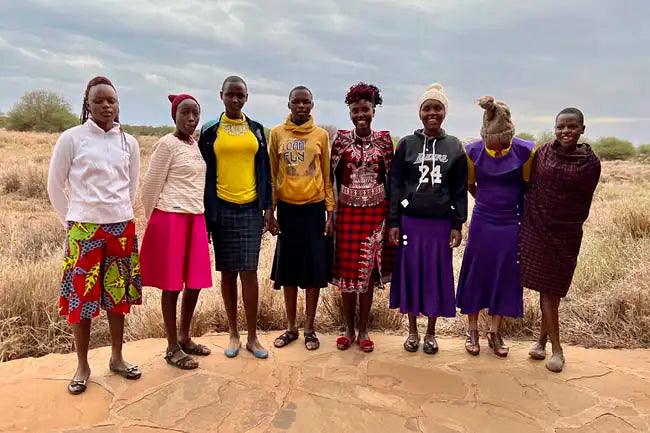 African women learning a benefitting from Saving the Wild donations