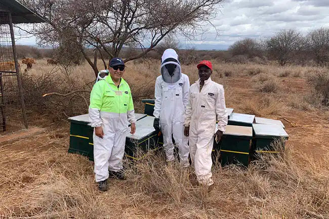 Carlos training local African bee keepers