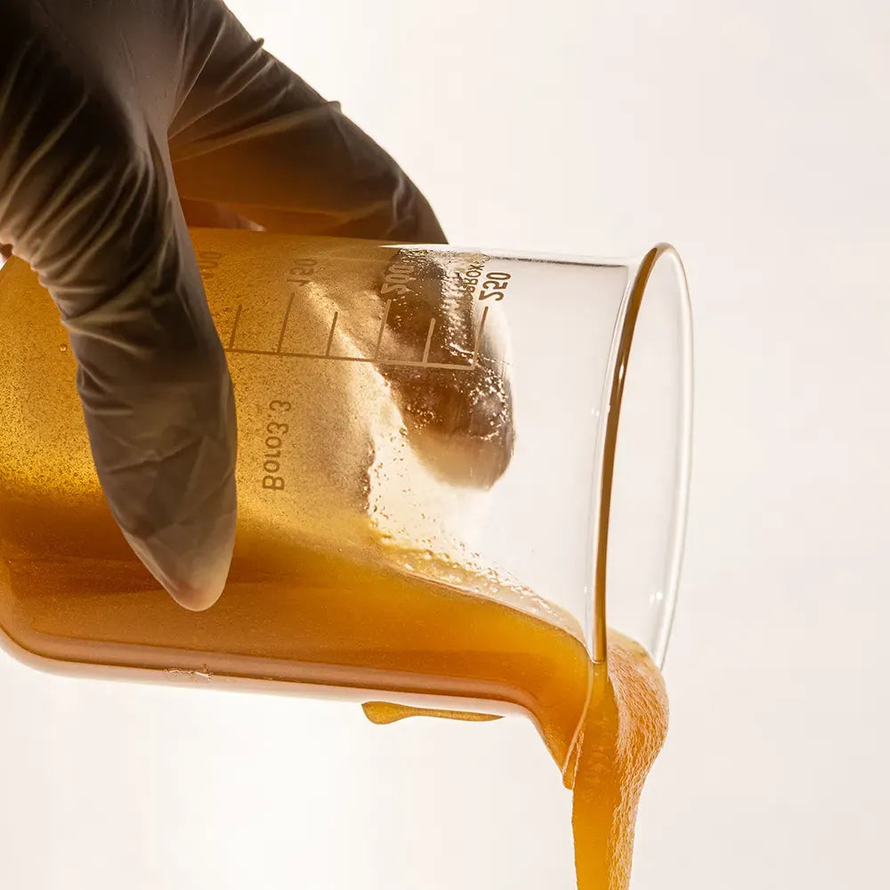 honey pouring from a beaker