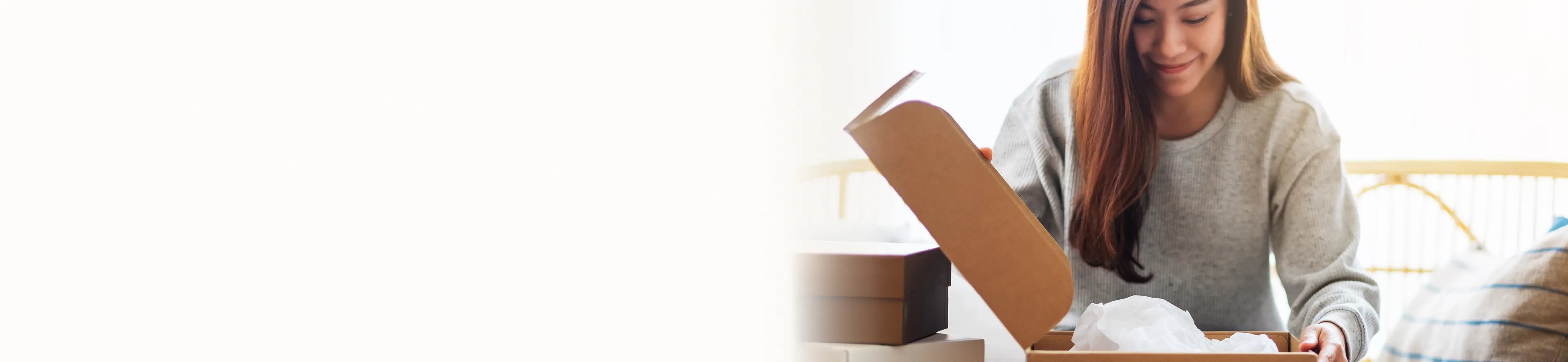 woman opening a gift box