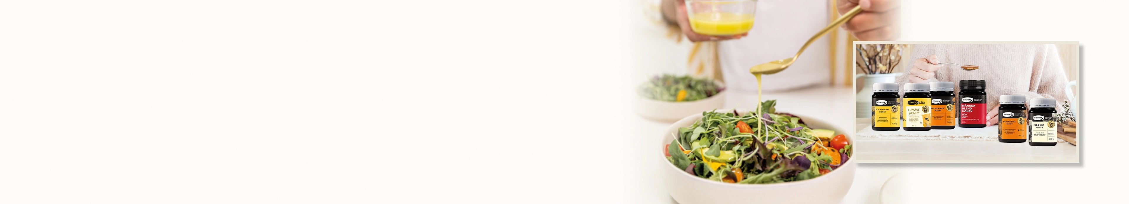 gourmet honey dressing being added to a salad