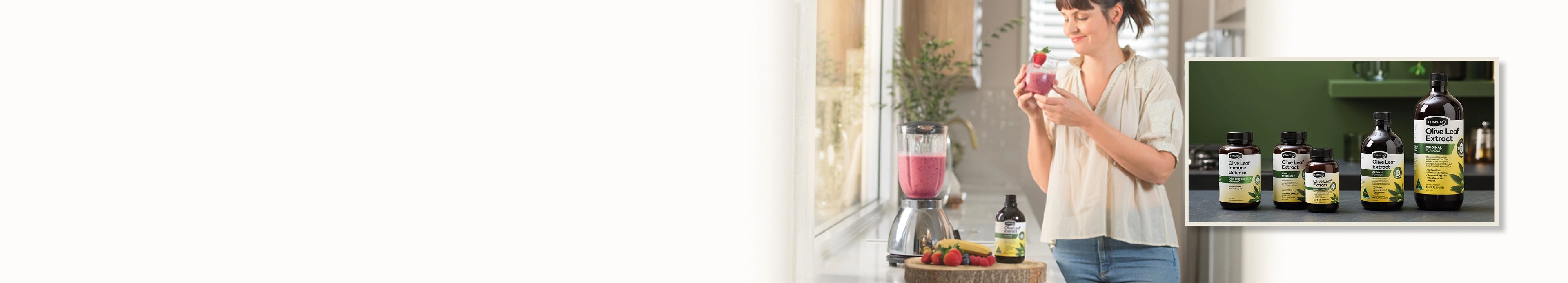 woman adding olive leaf extract to a smoothie