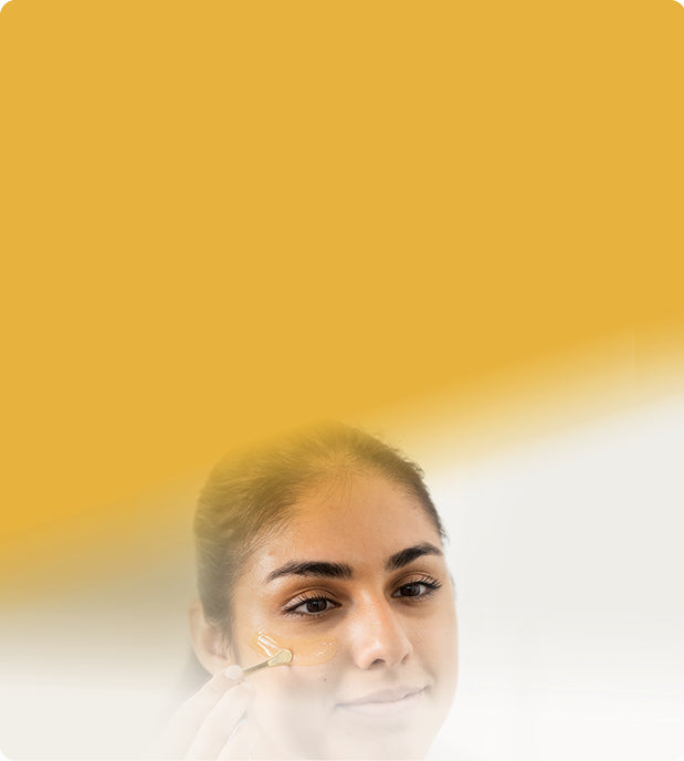 woman applying manuka honey to her skin